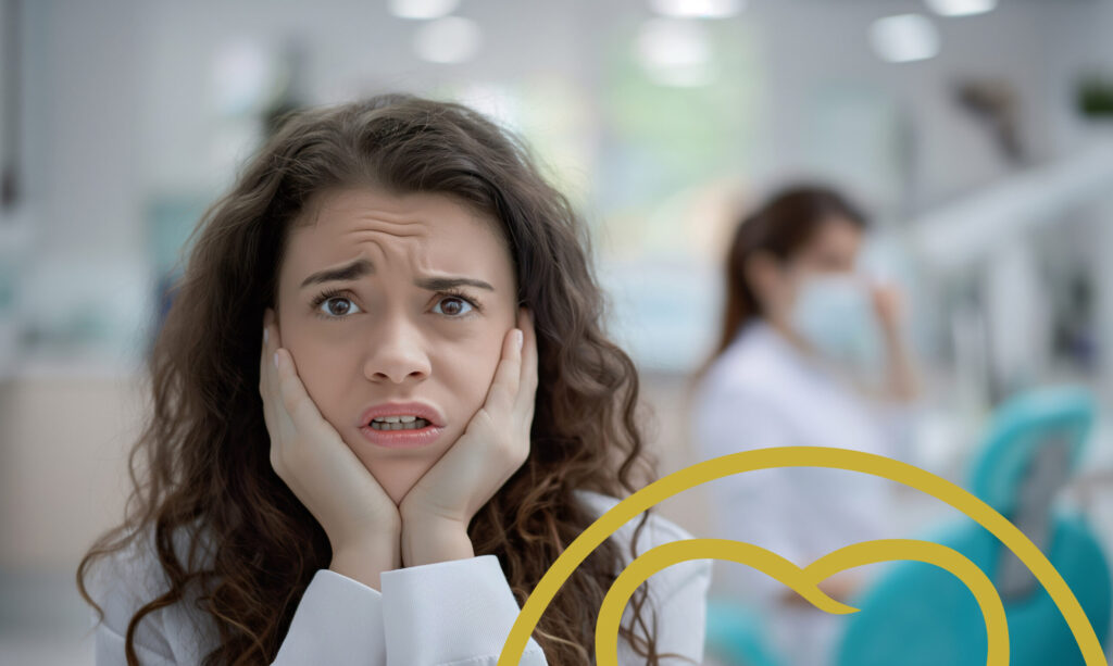 Girl with hands on face and a concerned looked