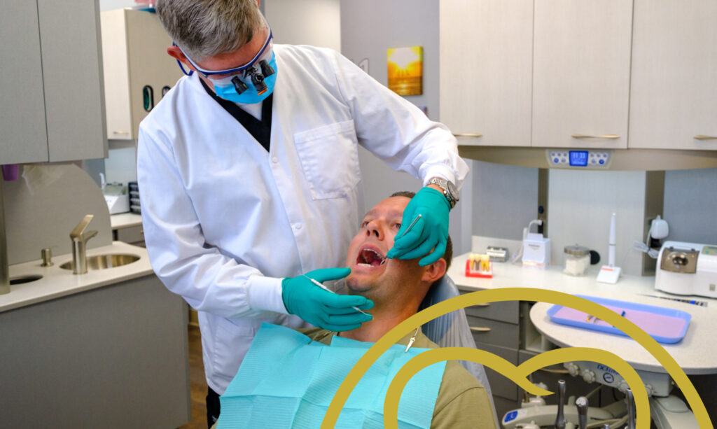 doctor checking patient in chair
