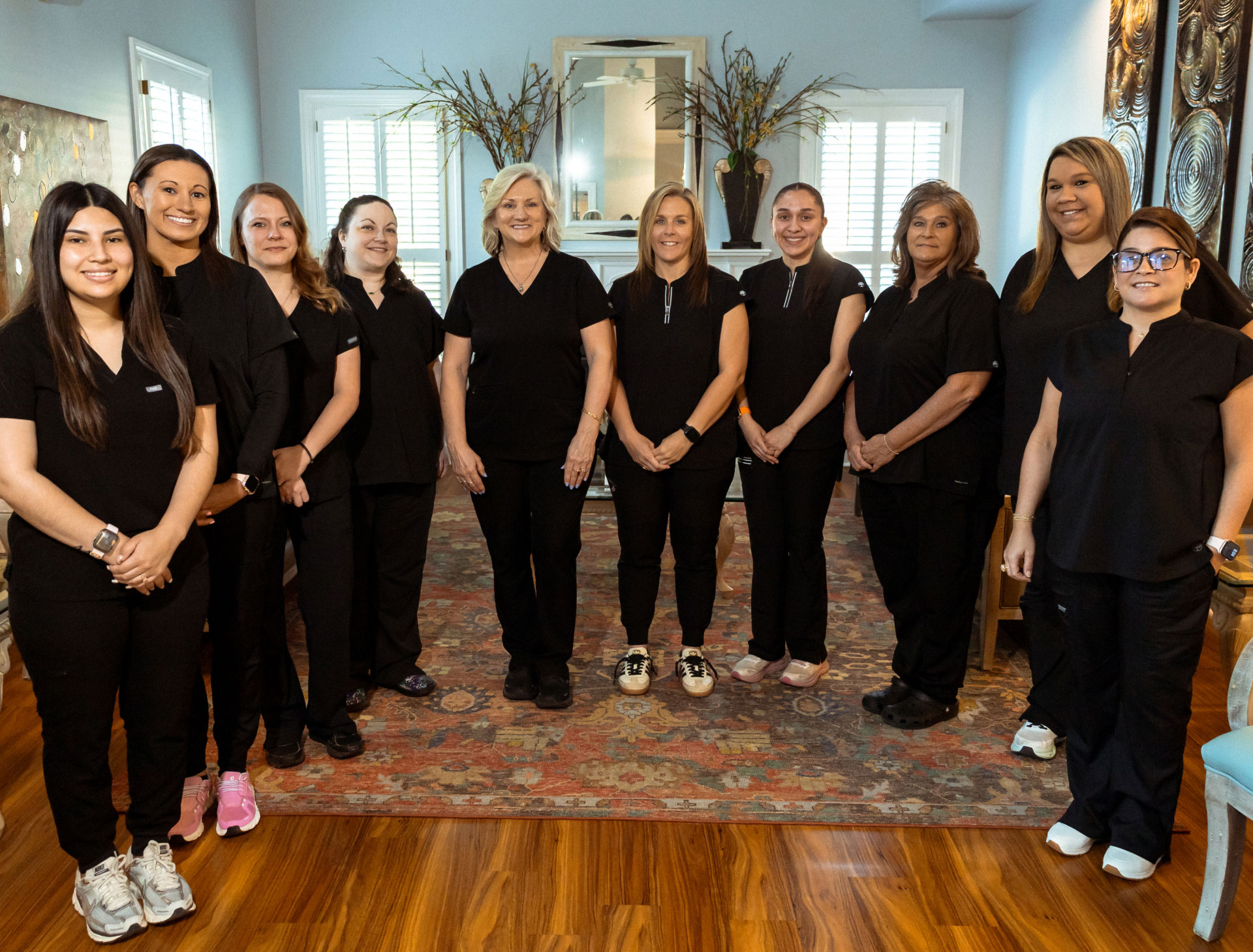 Business team posing for photo in reception area